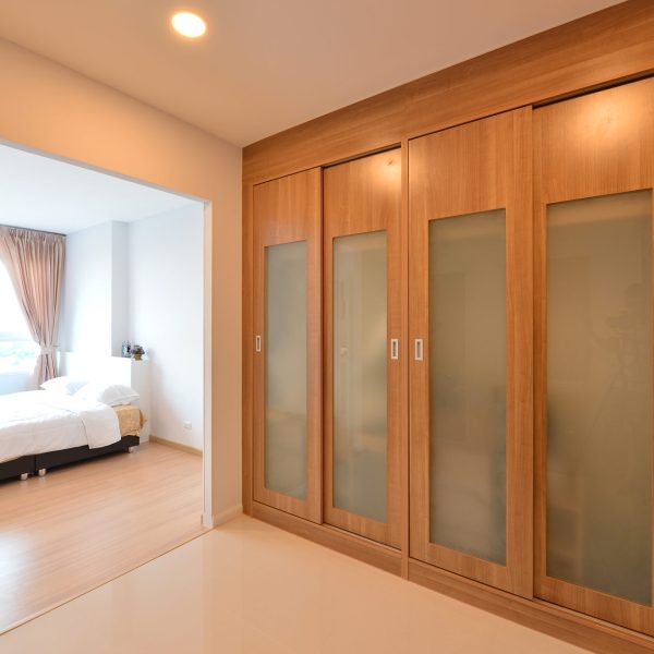 wooden carbinets in dressing room in modern home, interior design