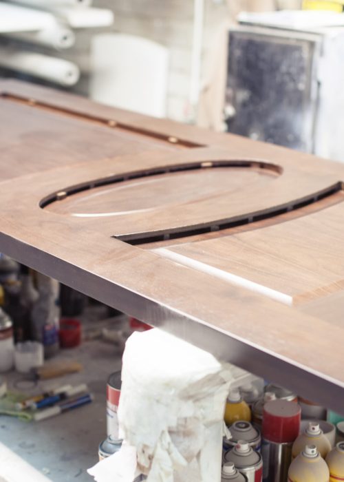 Lacquered wooden door at the factory. Painted door. Joiner's workshop on production of doors